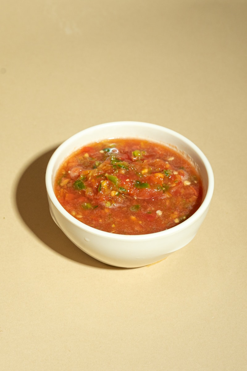 A bowl of soup is sitting on a table
